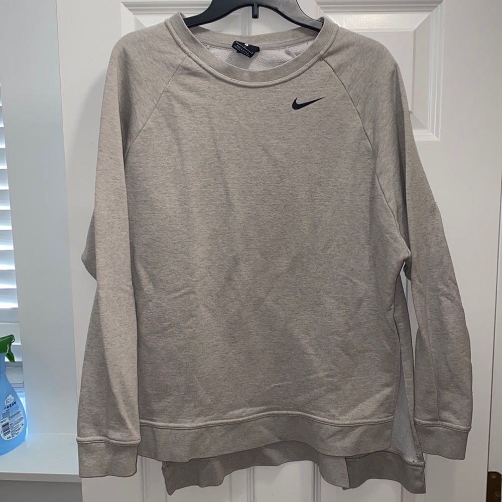 Gray Nike sweatshirt Slits up the sides and pocket